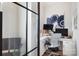 Home office with corner desk, two monitors, and glass partition at 13109 Brooklyn Skylar Way, Huntersville, NC 28078