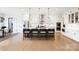 Modern kitchen with white cabinets, large island, and stainless steel appliances at 13109 Brooklyn Skylar Way, Huntersville, NC 28078