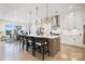Modern kitchen with white cabinets, large island, and stainless steel appliances at 13109 Brooklyn Skylar Way, Huntersville, NC 28078