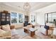Cozy living room with hardwood floors and a large window at 13109 Brooklyn Skylar Way, Huntersville, NC 28078
