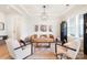 Bright and airy living room with a statement light fixture at 13109 Brooklyn Skylar Way, Huntersville, NC 28078