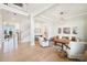 Open living room with hardwood floors, fireplace, and ample natural light at 13109 Brooklyn Skylar Way, Huntersville, NC 28078