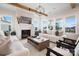 Bright living room with hardwood floors, fireplace, and large windows at 13109 Brooklyn Skylar Way, Huntersville, NC 28078