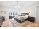 Spacious main bedroom with sitting area and large windows at 13109 Brooklyn Skylar Way, Huntersville, NC 28078