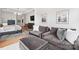 Cozy sitting area with two sofas and ottoman at 13109 Brooklyn Skylar Way, Huntersville, NC 28078