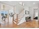 Grand staircase with white railings and wood steps at 13109 Brooklyn Skylar Way, Huntersville, NC 28078