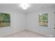 Bright bedroom with hardwood floors and large windows at 1600 Academy St, Charlotte, NC 28205