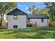 Rear view of charming house with white brick and deck at 1600 Academy St, Charlotte, NC 28205