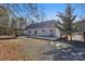 Exterior of home featuring a large back deck and covered grilling area at 1745 Badin Lake Rd, New London, NC 28127