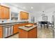 Kitchen with island, stainless steel appliances, and wood cabinets at 1745 Badin Lake Rd, New London, NC 28127