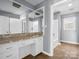 White vanity with a patterned countertop and mirrored medicine cabinet at 201 Ware St, Shelby, NC 28150