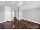 Bedroom with hardwood floors and access to hallway at 201 Ware St, Shelby, NC 28150