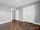 Bedroom with hardwood floors, gray walls, and double doors at 201 Ware St, Shelby, NC 28150