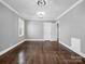 Spacious bedroom with hardwood floors and neutral gray walls at 201 Ware St, Shelby, NC 28150