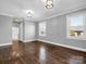 Hardwood floor bedroom with gray walls and two windows at 201 Ware St, Shelby, NC 28150