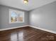 Hardwood floor bedroom with gray walls and one window at 201 Ware St, Shelby, NC 28150