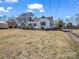 White house with black shutters and a large front yard at 201 Ware St, Shelby, NC 28150