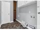 Bright laundry room with washer/dryer hookups and storage cabinets at 201 Ware St, Shelby, NC 28150