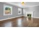 Spacious living room with hardwood floors, fireplace, and large windows at 201 Ware St, Shelby, NC 28150