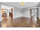 Open living room with hardwood floors and views into dining room and kitchen at 201 Ware St, Shelby, NC 28150