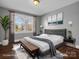 This spacious bedroom features hardwood floors, natural light, and stylish decor at 201 Ware St, Shelby, NC 28150