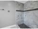 Shower with marble tile and pebble accents at 201 Ware St, Shelby, NC 28150