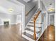 Wooden staircase with white railings leading to upper level at 201 Ware St, Shelby, NC 28150