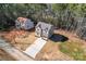 Overhead shot of a charming two-story house with an extended driveway and a peaceful, tree-lined setting at 2204 Hillcrest Ave, Albemarle, NC 28001