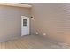 Back deck featuring a door entrance to the house and outdoor lighting at 2204 Hillcrest Ave, Albemarle, NC 28001