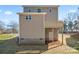 Back of two-story home featuring a wooden deck and a door to the basement at 2204 Hillcrest Ave, Albemarle, NC 28001