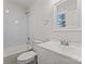 Cozy bathroom featuring a shower and tub combo with a large vanity sink and marble tile at 2204 Hillcrest Ave, Albemarle, NC 28001