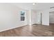 Bedroom boasts neutral walls, vinyl floors, and a large window letting in natural light at 2204 Hillcrest Ave, Albemarle, NC 28001