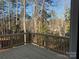 New wooden deck, built at the back of the home, overlooks a serene woodland at 2204 Hillcrest Ave, Albemarle, NC 28001