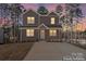 Two-story home with neutral siding, manicured lawn, and a paved driveway at 2204 Hillcrest Ave, Albemarle, NC 28001