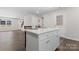 Eat-in kitchen features island with bar stool seating, hardwood floors, and an open layout at 2204 Hillcrest Ave, Albemarle, NC 28001
