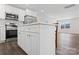 Modern kitchen features white cabinets, stainless steel appliances, and a quartz countertop island at 2204 Hillcrest Ave, Albemarle, NC 28001