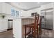 Modern kitchen featuring white cabinets, stainless appliances and hardwood floors at 2204 Hillcrest Ave, Albemarle, NC 28001