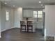 Well-lit kitchen with a central island and stainless steel refrigerator at 2204 Hillcrest Ave, Albemarle, NC 28001