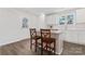 Bright kitchen features white cabinets, an island with seating, and stainless appliances at 2204 Hillcrest Ave, Albemarle, NC 28001