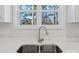 Stainless steel sink with quartz countertop in this bright kitchen with large window at 2204 Hillcrest Ave, Albemarle, NC 28001