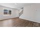 Inviting living room with hardwood floors, staircase, and plenty of natural light at 2204 Hillcrest Ave, Albemarle, NC 28001
