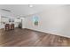 Open floor plan with hardwood floors that seamlessly blends the living space and modern kitchen at 2204 Hillcrest Ave, Albemarle, NC 28001