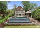 The backyard has a pool, spa and pavilion offering a private space for outdoor activities and relaxation at 2809 Glendale Rd, Charlotte, NC 28209