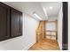Basement featuring custom wood shelving, recessed lighting, and wood flooring at 2809 Glendale Rd, Charlotte, NC 28209