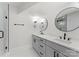 Modern bathroom featuring double sinks, elegant fixtures, and walk-in shower at 2809 Glendale Rd, Charlotte, NC 28209