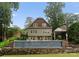 Rear exterior of home with a pool and waterfall feature at 2809 Glendale Rd, Charlotte, NC 28209