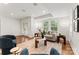 Cozy living area with stylish seating, natural lighting, and hardwood floors at 2809 Glendale Rd, Charlotte, NC 28209