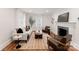The living room features hardwood floors, a fireplace, and neutral colors for a comfortable and stylish atmosphere at 2809 Glendale Rd, Charlotte, NC 28209