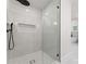 Modern walk-in shower with elegant tile, and convenient built-in niche at 2809 Glendale Rd, Charlotte, NC 28209