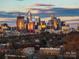 An aerial shot captures the skyline at sunset with golden light reflecting off the buildings at 287 Mcdonald Ave, Charlotte, NC 28203